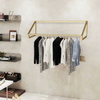 זהב מודרני פשוטה על הקיר אחסון בגד מדף בחנות בגדים ארגון דוכן תצוגה